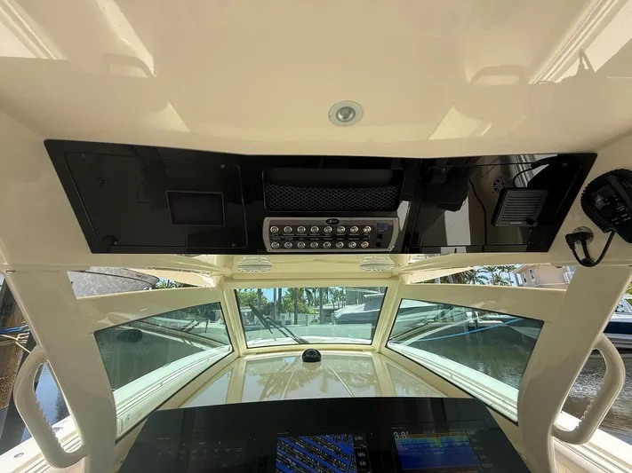 Reel Patience Yacht Photos Pics 2019 Scout 420 LXF boat interior with control panel and navigation equipment.