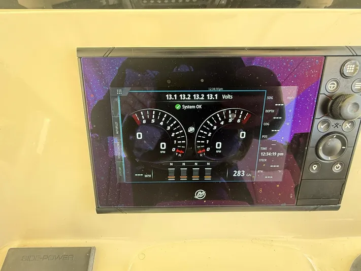 Reel Patience Yacht Photos Pics Dashboard of a 2019 Scout 420 LXF boat showing digital gauges and controls.