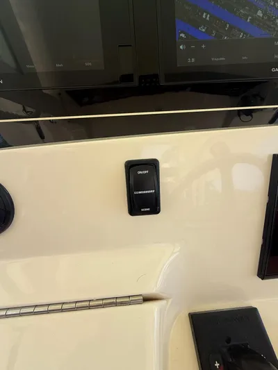 Reel Patience Yacht Photos Pics Control panel of a 2019 Scout 420 LXF boat with Lumishore switch.