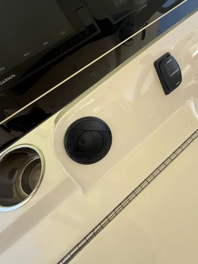 Reel Patience Yacht Photos Pics Control panel of 2019 Scout 420 LXF boat with Garmin display and switches.