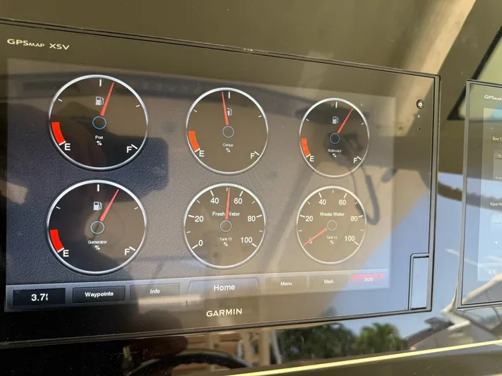 Reel Patience Yacht Photos Pics Dashboard of a 2019 Scout 420 LXF boat with fuel and water gauges.