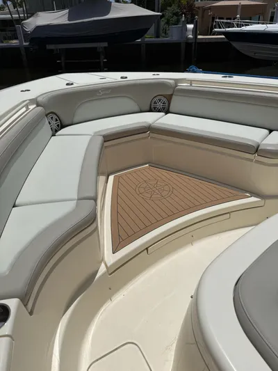 Reel Patience Yacht Photos Pics Luxurious seating area on a 2019 Scout 420 LXF boat with elegant wood detailing.