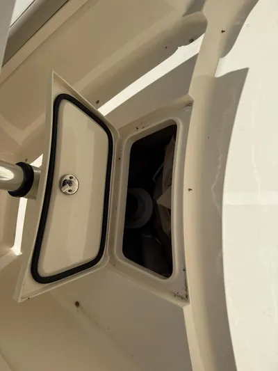 Reel Patience Yacht Photos Pics Open storage compartment on a 2019 Scout 420 LXF boat.