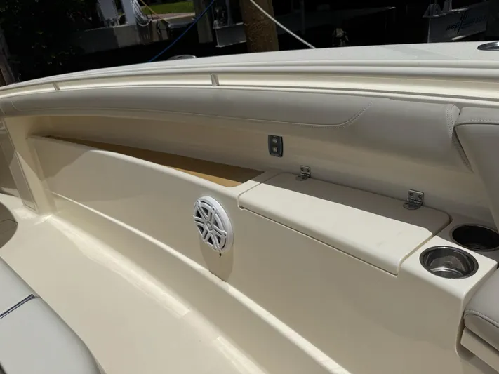 Reel Patience Yacht Photos Pics 2019 Scout 420 LXF boat interior with speaker and cup holders.