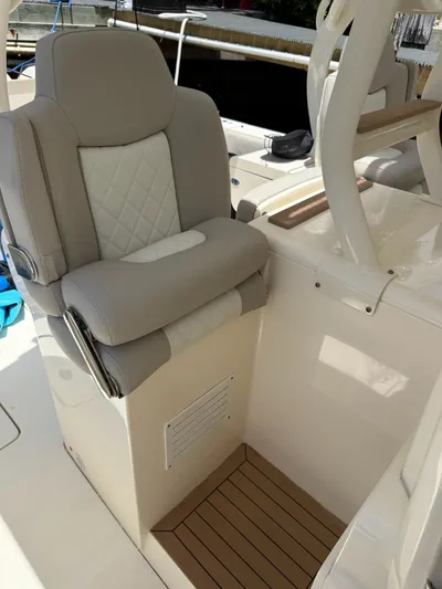 Reel Patience Yacht Photos Pics Luxurious seating on 2019 Scout 420 LXF boat, featuring elegant design and premium materials.