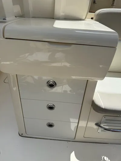 Reel Patience Yacht Photos Pics 2019 Scout 420 LXF boat interior with storage drawers and seating.