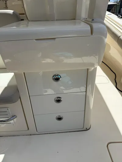 Reel Patience Yacht Photos Pics 2019 Scout 420 LXF boat interior with storage drawers and seating.