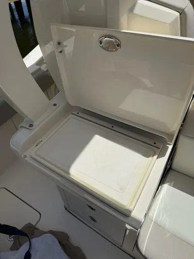 Reel Patience Yacht Photos Pics Open storage compartment on a 2019 Scout 420 LXF boat.