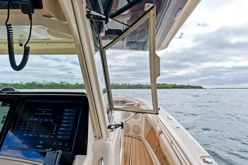 Off Line Yacht Photos Pics 2023 HCB 53 Suenos RXV boat interior with open window, overlooking calm waters.