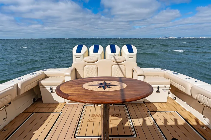 Off Line Yacht Photos Pics 2023 HCB 53 Suenos RXV yacht deck with elegant seating and ocean view.