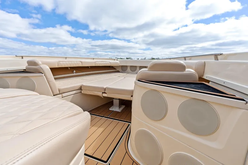 Off Line Yacht Photos Pics Luxurious interior of 2023 HCB 53 Suenos RXV boat with beige seating and wood flooring.