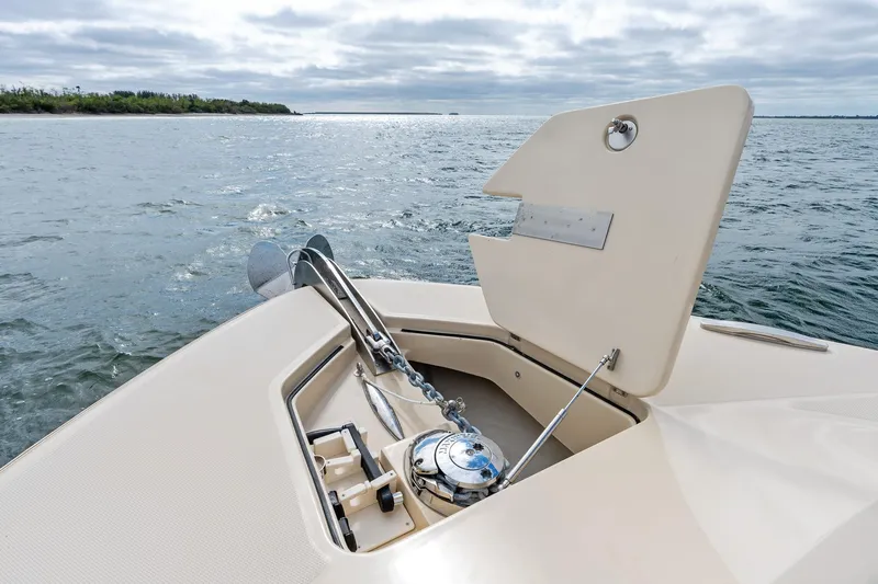Off Line Yacht Photos Pics 2023 HCB 53 Suenos RXV boat anchor compartment open on calm water.