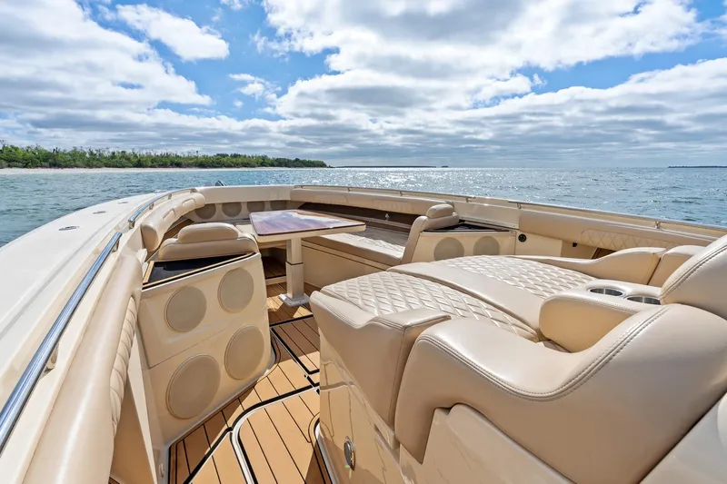 Off Line Yacht Photos Pics Luxurious 2023 HCB 53 Suenos RXV boat interior with elegant seating and ocean view.