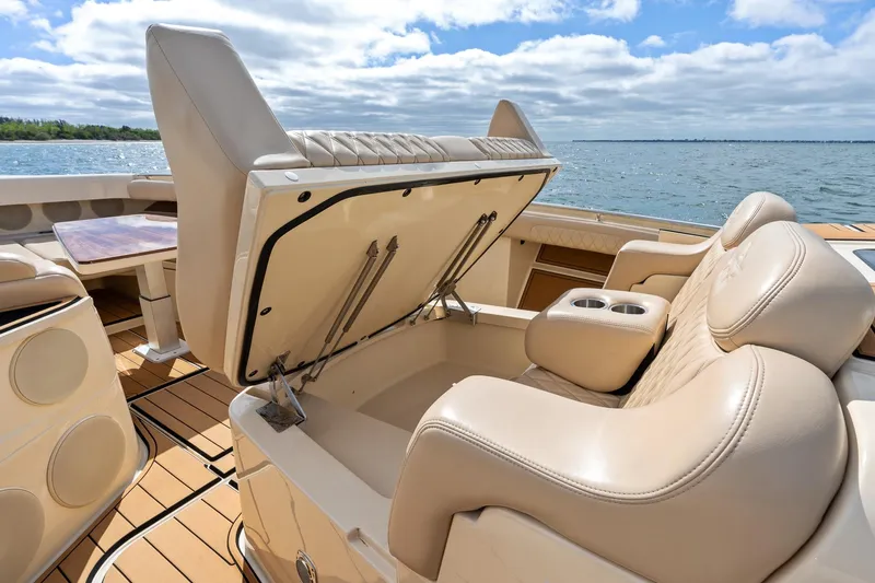 Off Line Yacht Photos Pics 2023 HCB 53 Suenos RXV boat interior with luxurious seating and storage.