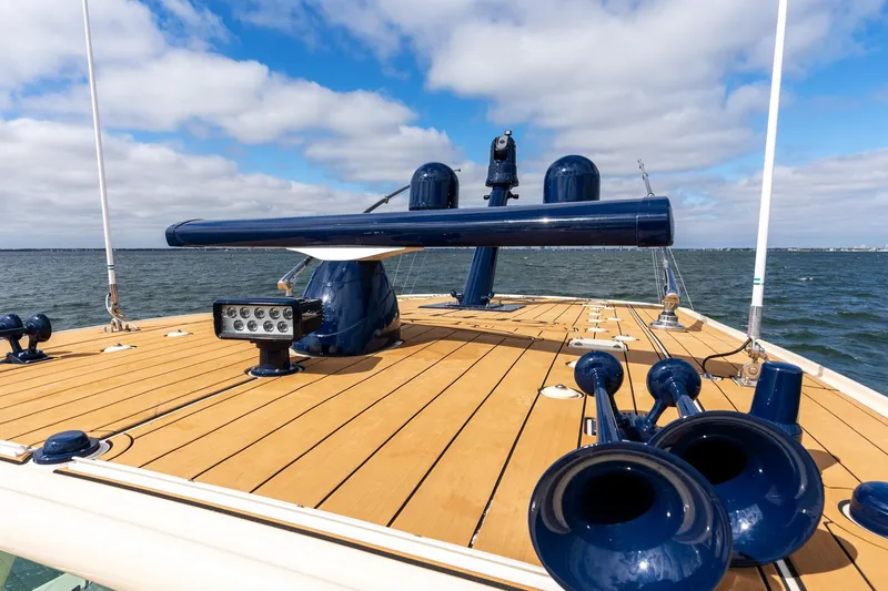 Off Line Yacht Photos Pics 2023 HCB 53 Suenos RXV boat deck with blue accents on open water.