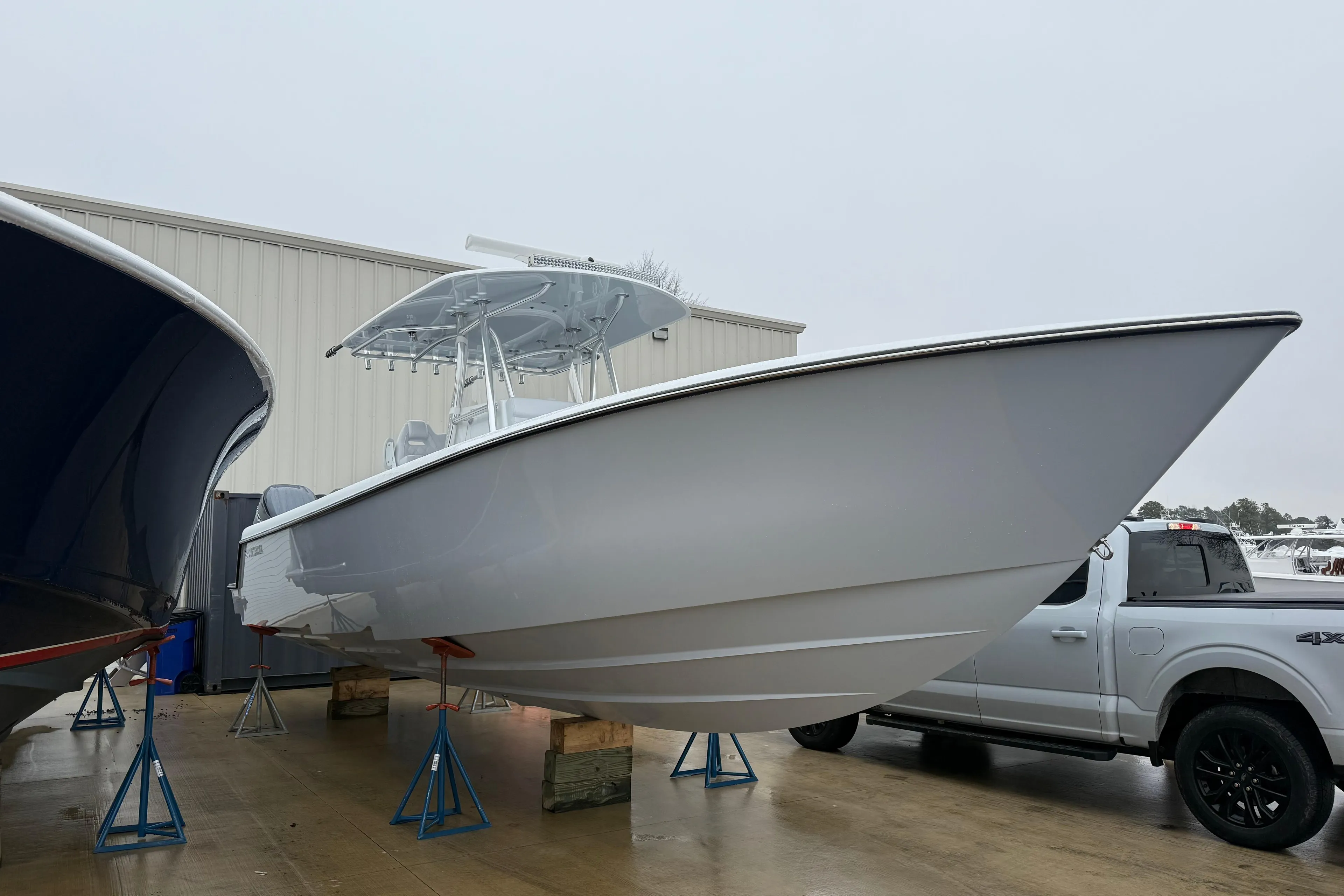 2026 Contender 35 ST boat on stands beside a truck, ready for launch.
