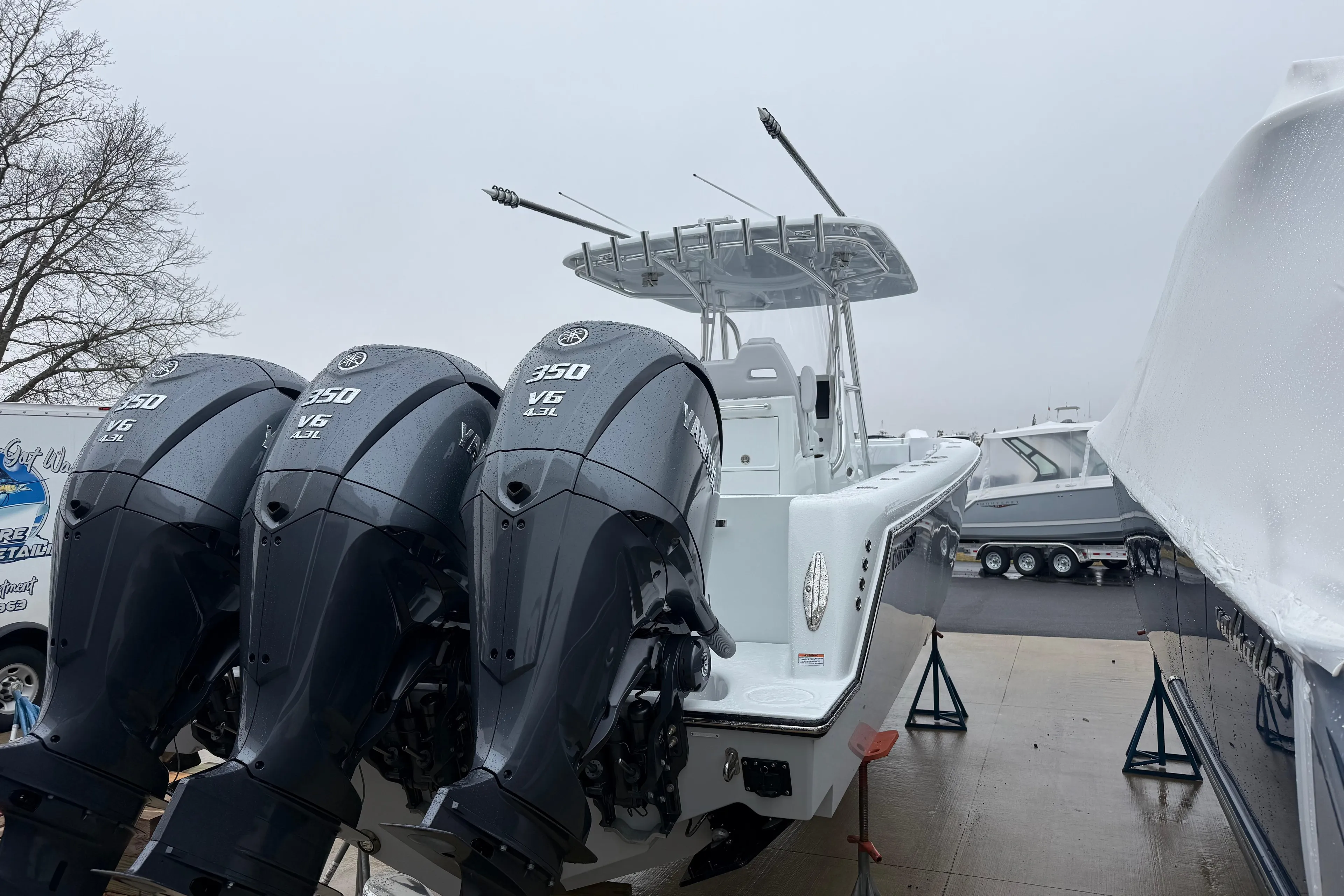 2026 Contender 35 ST boat with triple Yamaha 350 V6 engines on display.