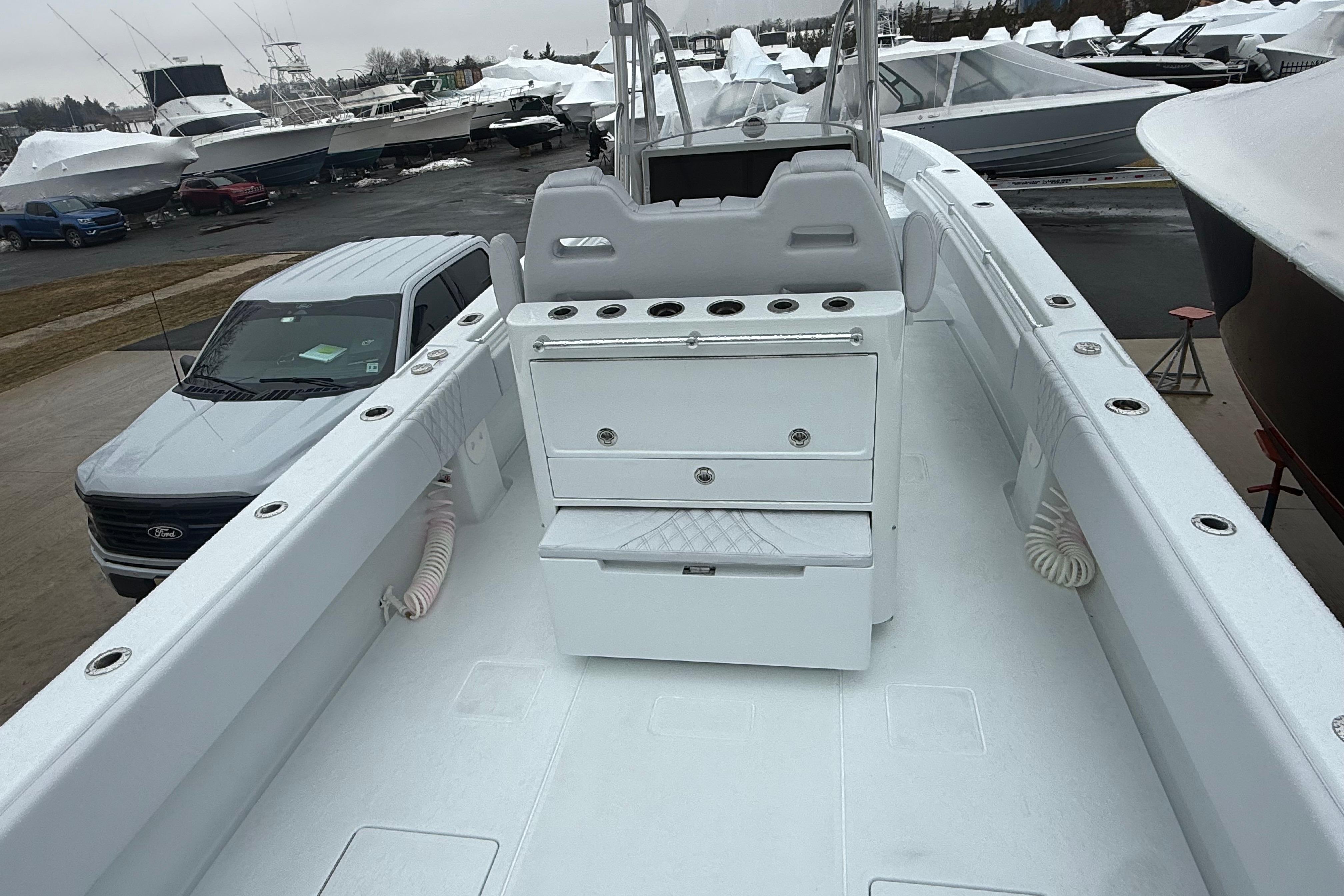 2026 Contender 35 ST boat interior with storage compartments and rod holders.