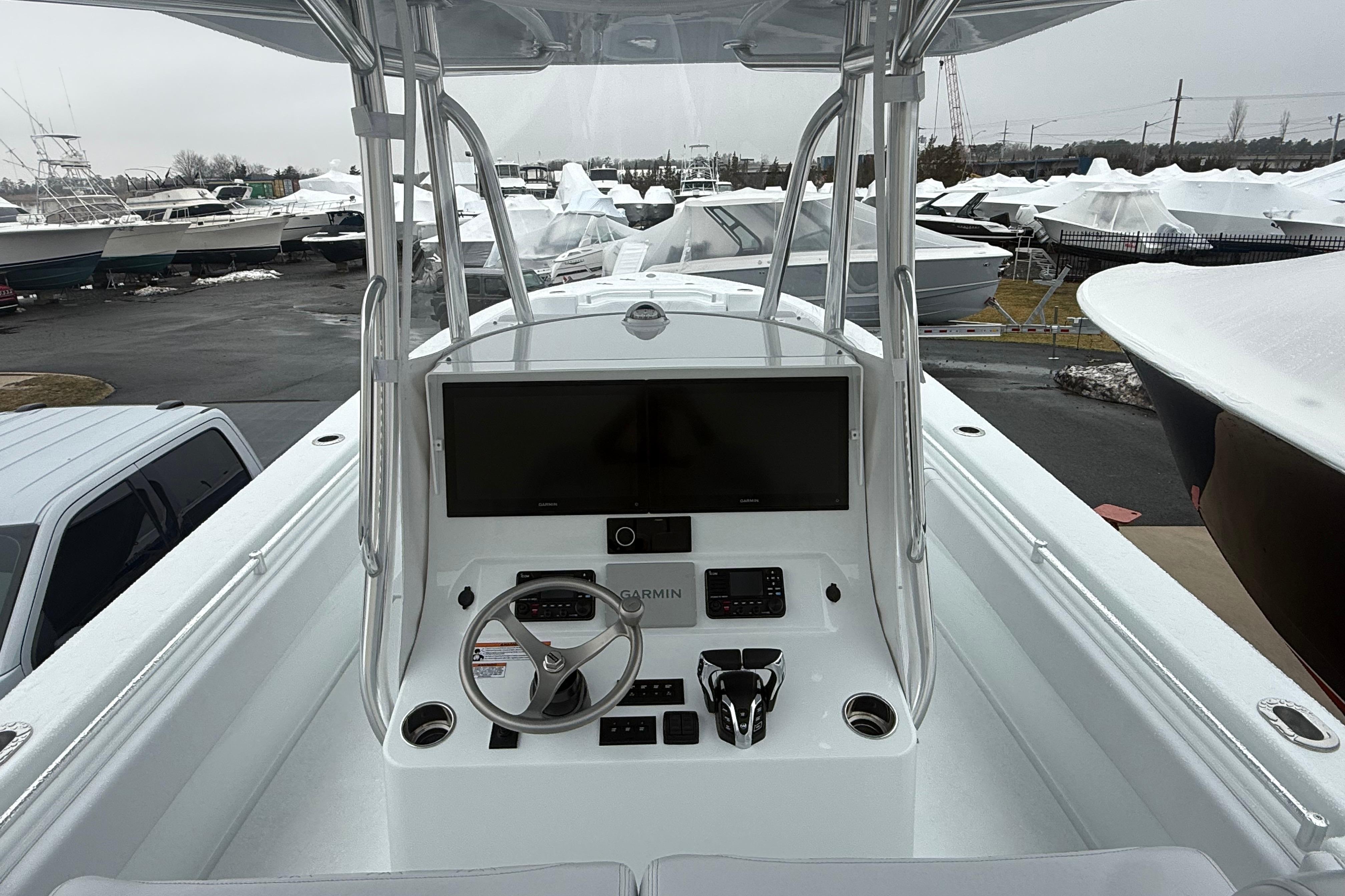 2026 Contender 35 ST boat console with steering wheel and navigation display.