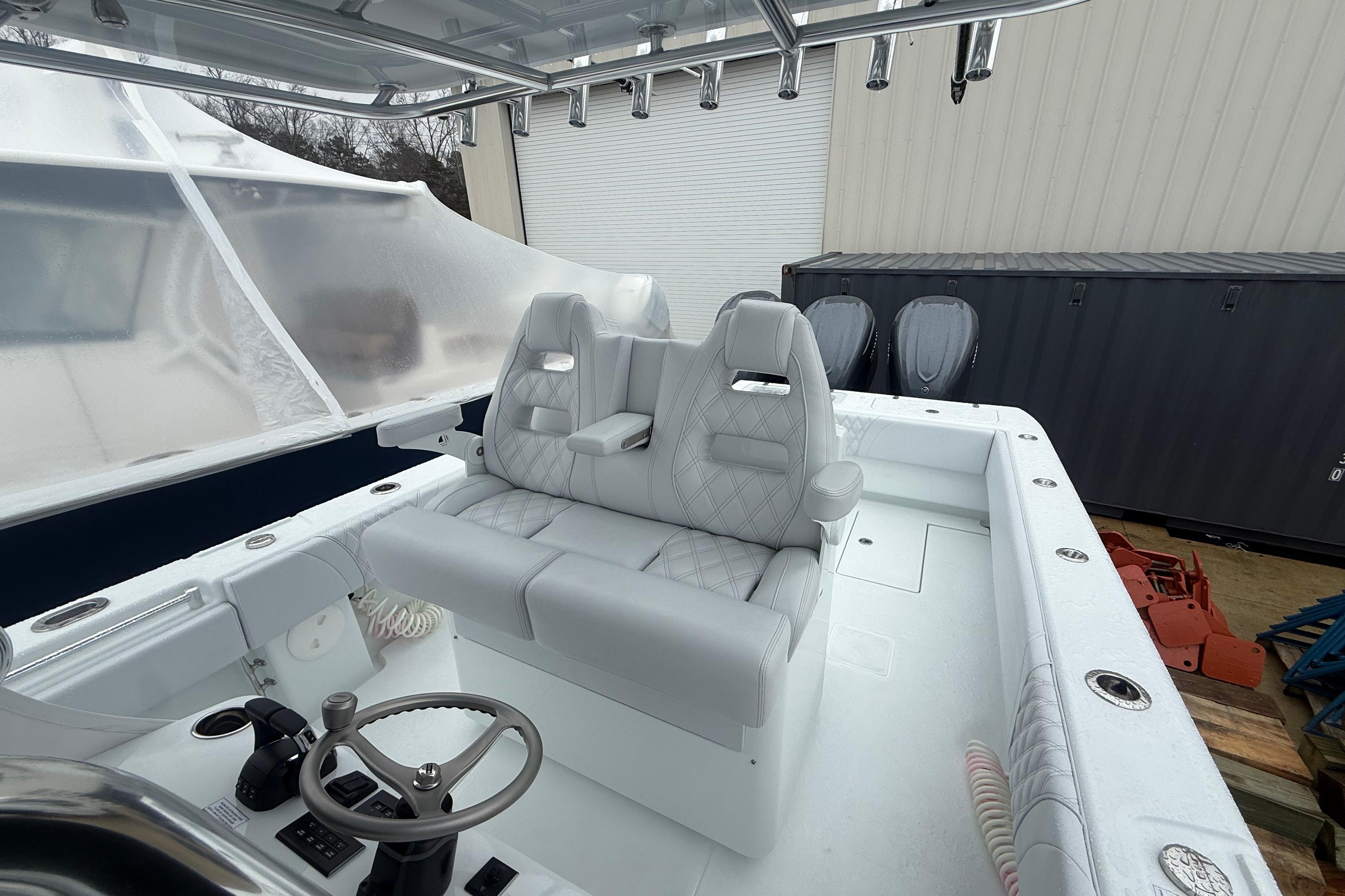 2026 Contender 35 ST boat interior with dual seats and steering console.