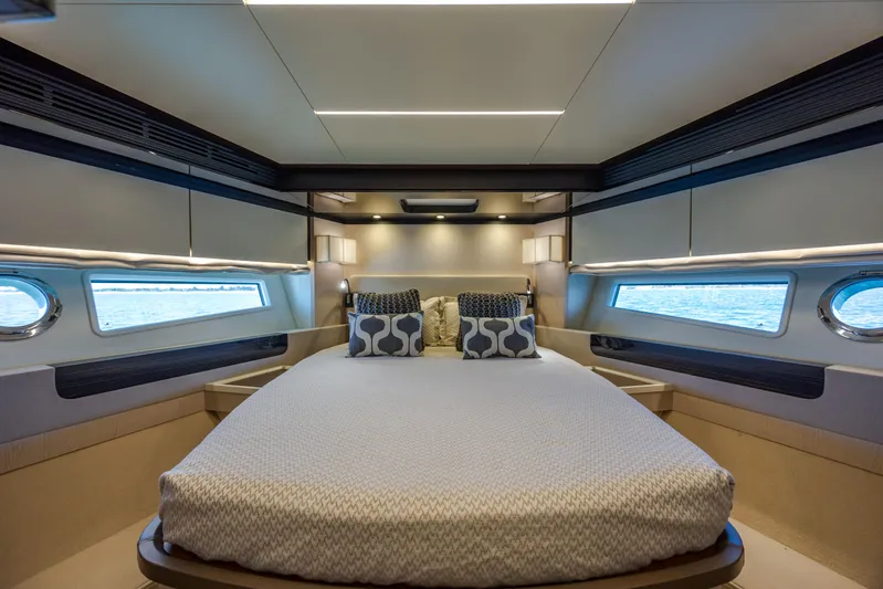  Yacht Photos Pics Luxurious bedroom interior of 2019 Azimut 66 FLY yacht with modern design and ocean view.