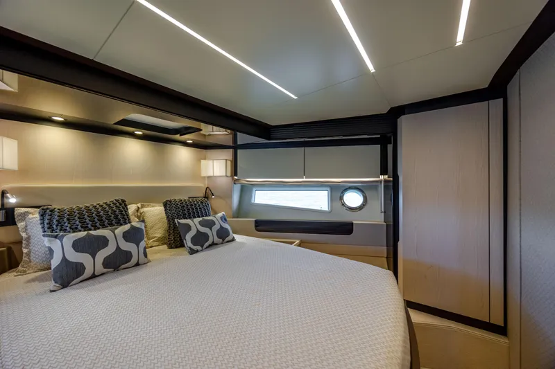  Yacht Photos Pics Luxurious bedroom interior of 2019 Azimut 66 FLY yacht with modern design and elegant lighting.