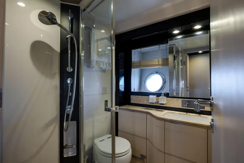  Yacht Photos Pics Luxurious bathroom interior of 2019 Azimut 66 FLY yacht with modern shower and vanity.