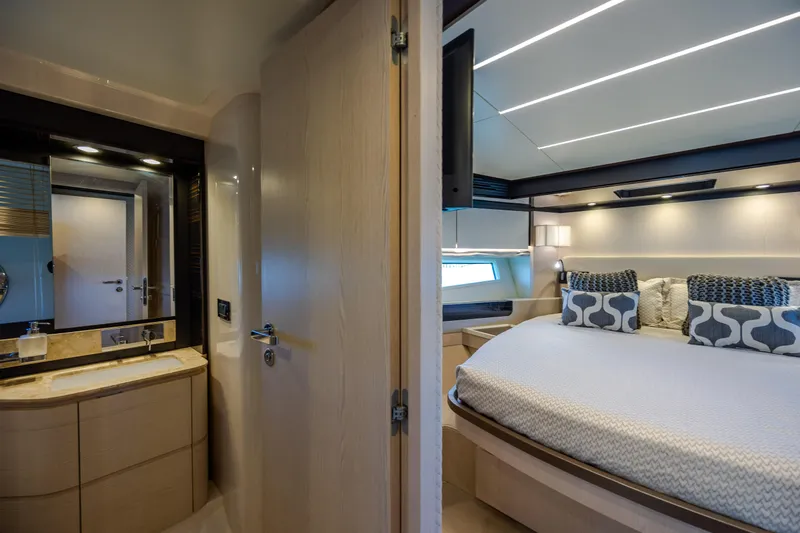  Yacht Photos Pics Luxurious bedroom and bathroom interior of 2019 Azimut 66 FLY yacht.