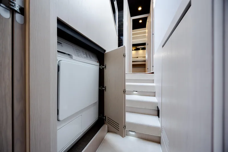  Yacht Photos Pics Interior of 2019 Azimut 66 FLY yacht with laundry area and stairs.