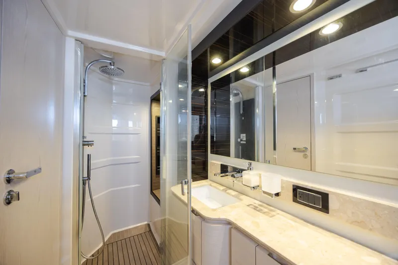  Yacht Photos Pics Luxurious bathroom in 2019 Azimut 66 FLY yacht with modern shower and elegant fixtures.