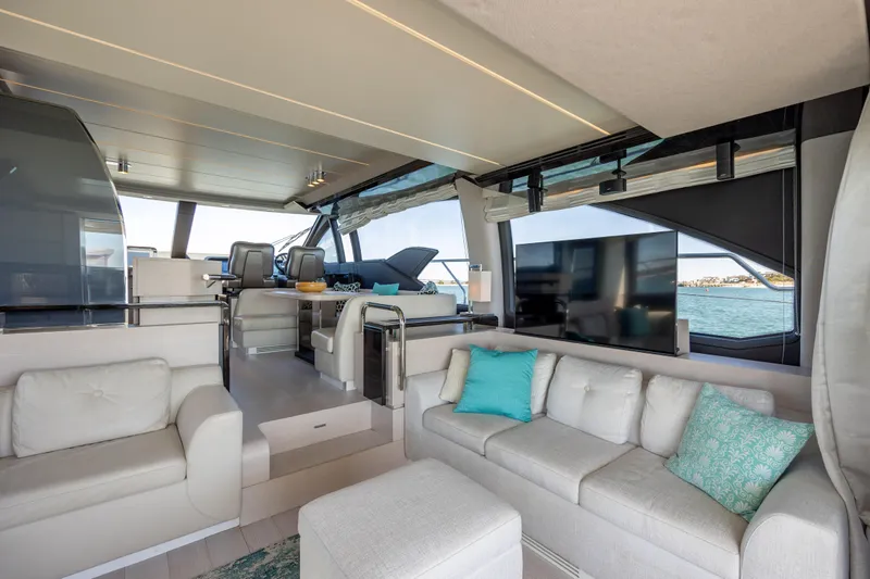  Yacht Photos Pics Luxurious interior of 2019 Azimut 66 FLY yacht with modern seating and ocean view.