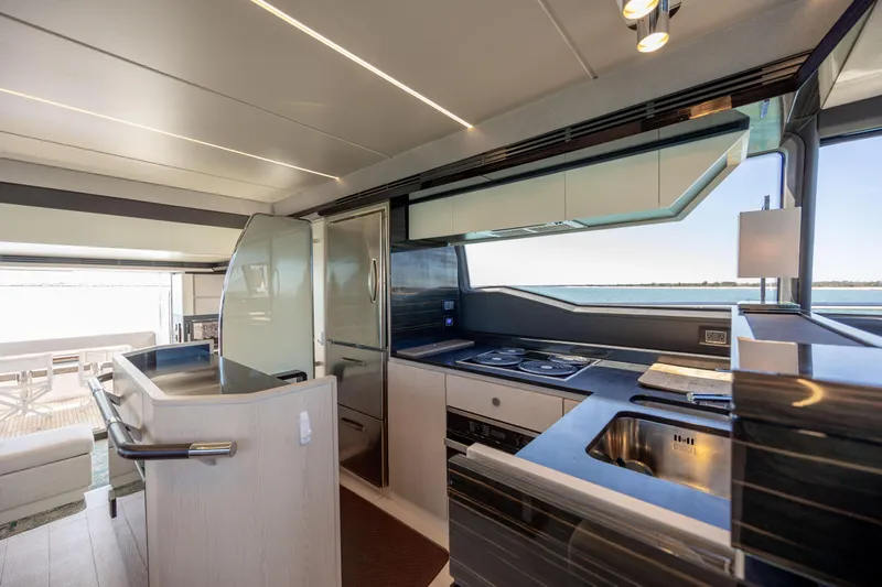  Yacht Photos Pics Luxurious kitchen interior of 2019 Azimut 66 FLY yacht with modern appliances and ocean view.