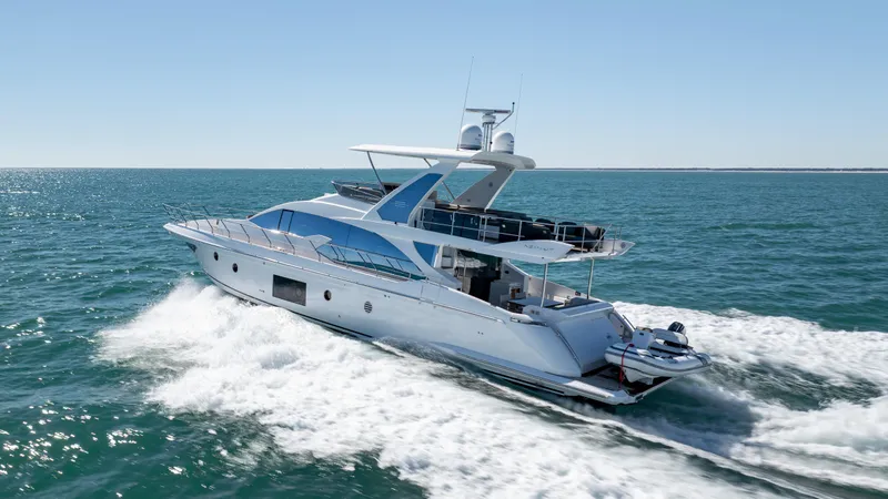  Yacht Photos Pics 2019 Azimut 66 FLY yacht cruising on open sea, showcasing sleek design and luxury.