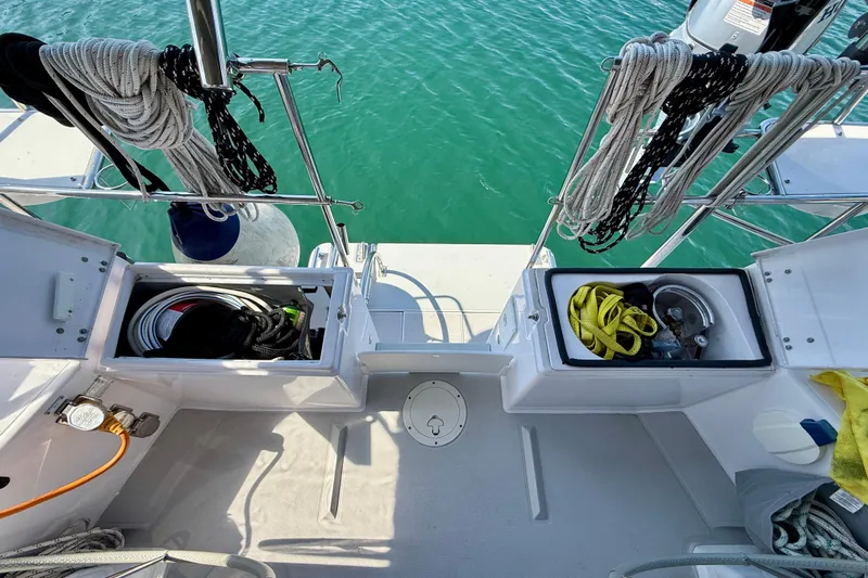 Nereid Yacht Photos Pics 2020 Catalina 425 sailboat deck with storage compartments and coiled ropes.