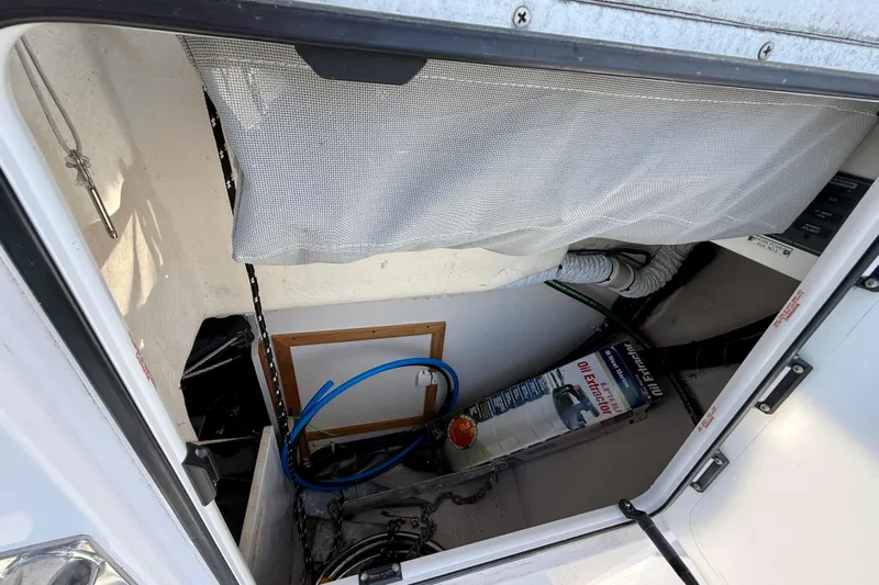 Nereid Yacht Photos Pics Storage compartment in a 2020 Catalina 425 sailboat with various equipment and tools.