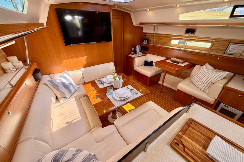 Nereid Yacht Photos Pics Luxurious interior of 2020 Catalina 425 yacht with elegant seating and dining area.