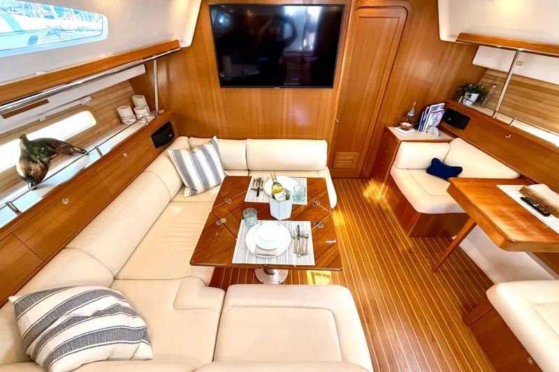 Nereid Yacht Photos Pics Luxurious interior of 2020 Catalina 425 yacht with elegant seating and dining area.