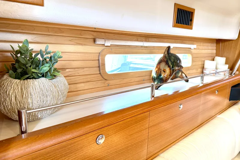 Nereid Yacht Photos Pics Interior of 2020 Catalina 425 yacht with decorative plant and dolphin sculpture.