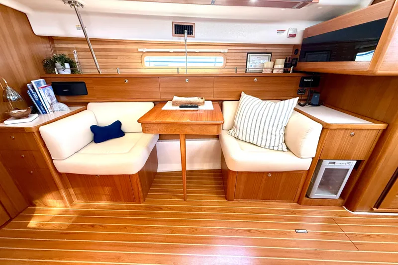 Nereid Yacht Photos Pics Luxurious 2020 Catalina 425 yacht interior with cozy seating and elegant wooden finishes.