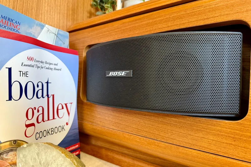 Nereid Yacht Photos Pics Bose speaker and cookbook on Catalina 425 yacht, 2020 model, wooden interior.