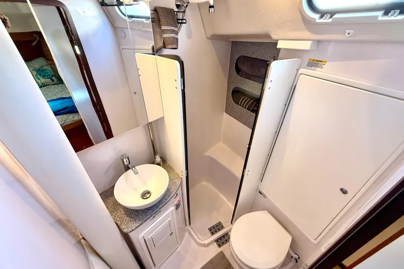 Nereid Yacht Photos Pics Modern bathroom in 2020 Catalina 425 yacht with sink, toilet, and storage.