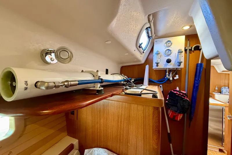 Nereid Yacht Photos Pics Interior of a 2020 Catalina 425 yacht featuring equipment and wooden cabinetry.