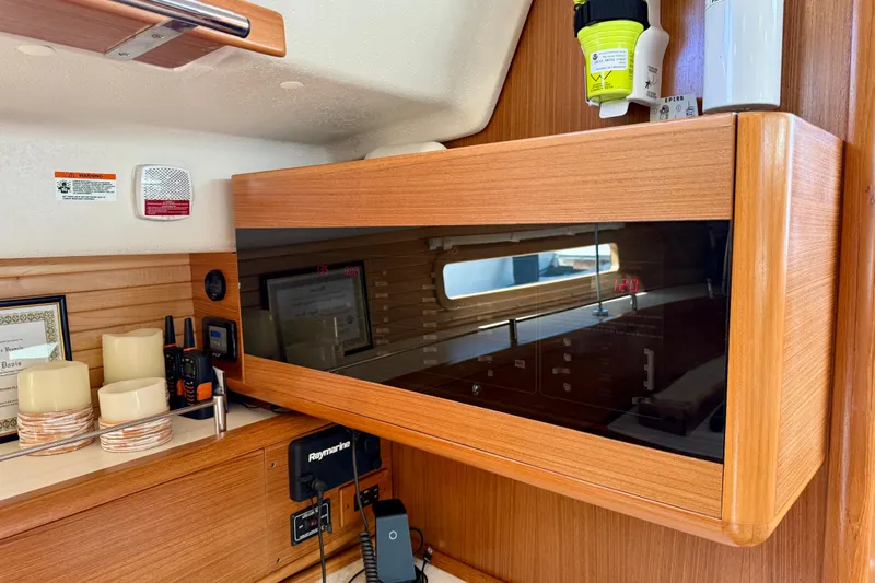 Nereid Yacht Photos Pics Interior of a 2020 Catalina 425 yacht featuring wooden cabinetry and modern navigation equipment.