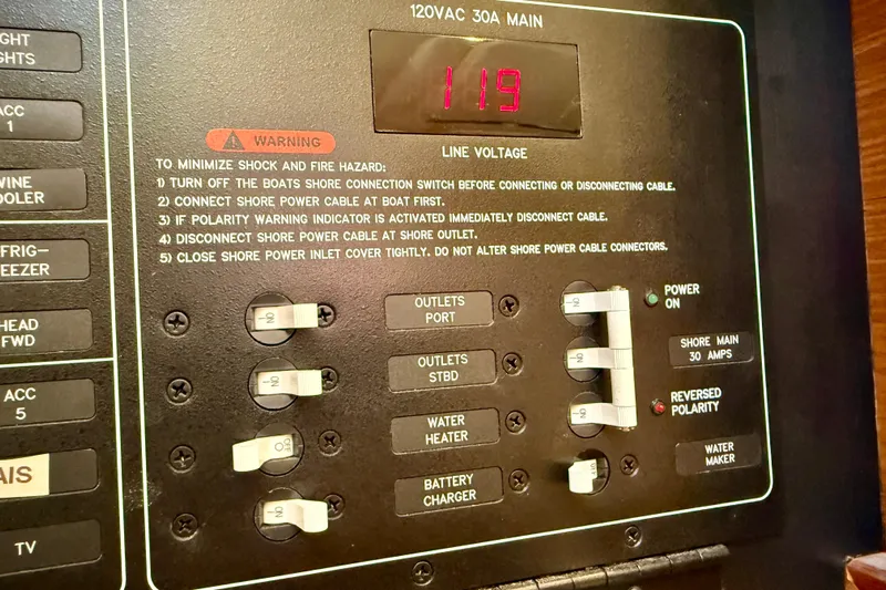 Nereid Yacht Photos Pics Electrical panel of a 2020 Catalina 425 boat showing voltage and safety instructions.