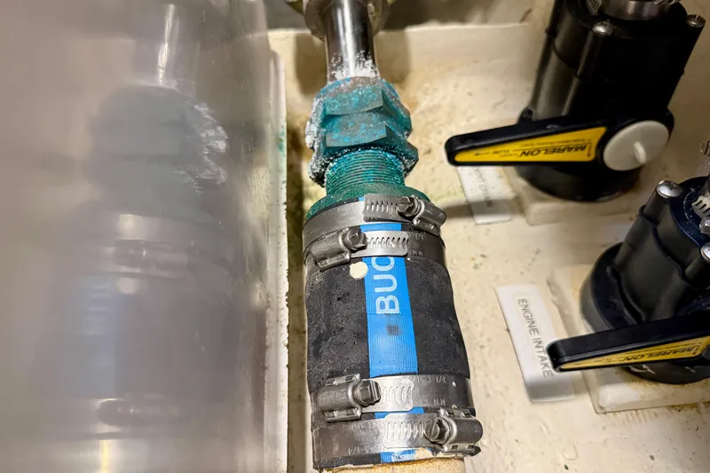 Nereid Yacht Photos Pics Engine compartment of 2020 Catalina 425 with hoses and valves visible.