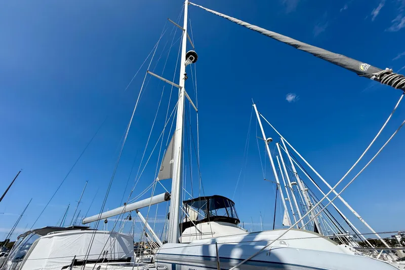 Nereid Yacht Photos Pics 2020 Catalina 425 sailboat with tall mast against clear blue sky.