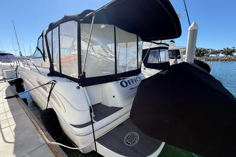 The Office Yacht Photos Pics 2003 Sea Ray 380 Sundancer docked at marina under clear blue sky.