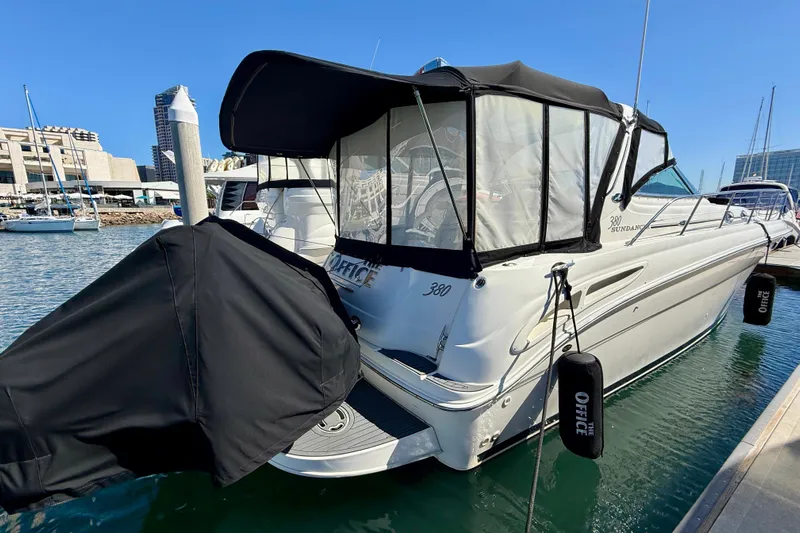 The Office Yacht Photos Pics 2003 Sea Ray 380 Sundancer docked at marina, featuring black canopy and sleek design.