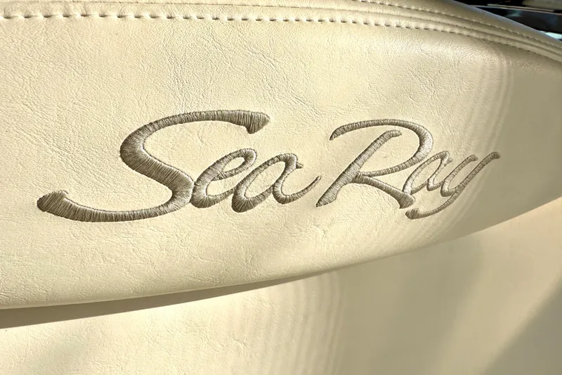 The Office Yacht Photos Pics Sea Ray logo embroidered on beige leather seat, 2003 Sea Ray 380 Sundancer.