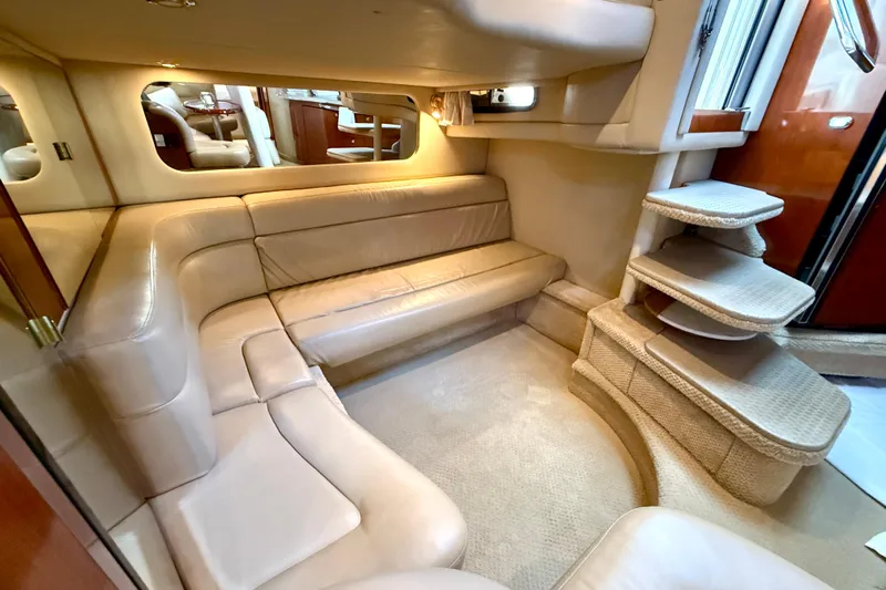 The Office Yacht Photos Pics Luxurious interior of 2003 Sea Ray 380 Sundancer with beige leather seating and elegant design.